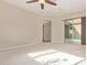 Bright bedroom with sliding door to patio access at 21438 S 194Th St, Queen Creek, AZ 85142