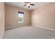 Well-lit bedroom with neutral walls and carpet at 21438 S 194Th St, Queen Creek, AZ 85142