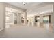 Open dining room with tile floors and views into the Gathering room and kitchen at 21438 S 194Th St, Queen Creek, AZ 85142