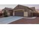 This home features a two-car garage and nicely landscaped yard at 21438 S 194Th St, Queen Creek, AZ 85142