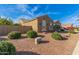 Single story home with a two-car garage and nicely landscaped front yard at 21438 S 194Th St, Queen Creek, AZ 85142