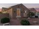 Single-story home with a two-car garage and well-manicured desert landscaping at 21438 S 194Th St, Queen Creek, AZ 85142