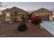 Beautiful desert landscape featuring a single-story home with a three-car garage at 21438 S 194Th St, Queen Creek, AZ 85142