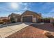 Single story home with a two-car garage and nicely landscaped front yard at 21438 S 194Th St, Queen Creek, AZ 85142