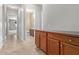 Home hallway with tiled floor and built-in cabinets at 21438 S 194Th St, Queen Creek, AZ 85142