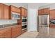 Spacious kitchen featuring stainless steel appliances and ample cabinetry at 21438 S 194Th St, Queen Creek, AZ 85142