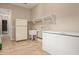 Laundry room with a sink, shelving and extra refrigerator at 21438 S 194Th St, Queen Creek, AZ 85142
