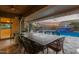 Outdoor patio area with seating, fire pit and pool views at 21438 S 194Th St, Queen Creek, AZ 85142