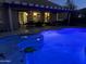 Lighted pool at night with a covered patio at 21438 S 194Th St, Queen Creek, AZ 85142