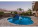 Stunning kidney shaped pool with a stone water feature at 21438 S 194Th St, Queen Creek, AZ 85142