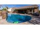 Relaxing kidney-shaped pool with patio and seating area at 21438 S 194Th St, Queen Creek, AZ 85142
