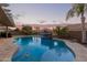 Inviting kidney-shaped pool with a tiled water feature at 21438 S 194Th St, Queen Creek, AZ 85142