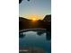 Stunning sunset view reflected in the pool at 21438 S 194Th St, Queen Creek, AZ 85142