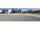 Beautifully modern home with a light exterior, a gated entrance, and desert landscaping at 475 W Saddle Mountain Road --, Phoenix, AZ 85086