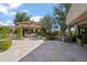 Sprawling backyard featuring a covered pergola with outdoor seating, complemented by lush landscaping and hardscape at 6322 E Turquoise Ave, Paradise Valley, AZ 85253