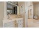 Charming bathroom featuring custom vanity, stone countertop, stylish decor, and an abundance of natural light at 6322 E Turquoise Ave, Paradise Valley, AZ 85253