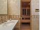 Bathroom with adjacent sauna; tiled walls and classic fixtures at 6322 E Turquoise Ave, Paradise Valley, AZ 85253