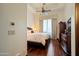 Inviting bedroom with hardwood floors, decorative ceiling, and a comfortable bed and a dresser at 6322 E Turquoise Ave, Paradise Valley, AZ 85253