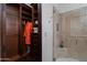 The walk-in closet shows custom shelves, drawers, and an orange robe at 6322 E Turquoise Ave, Paradise Valley, AZ 85253