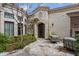 Secluded front courtyard with stone flooring, mature trees, and cozy seating area at 6322 E Turquoise Ave, Paradise Valley, AZ 85253