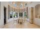 Charming dining room with chandelier, domed ceiling and large windows at 6322 E Turquoise Ave, Paradise Valley, AZ 85253