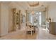 This elegant dining room offers a chandelier, custom cabinetry, and natural light at 6322 E Turquoise Ave, Paradise Valley, AZ 85253