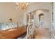 The dining room showcases a wooden table, ornate hutch, and a chandelier at 6322 E Turquoise Ave, Paradise Valley, AZ 85253