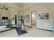 Home gym with floor-to-ceiling mirror, modern exercise equipment, and easy access to the private bathroom at 6322 E Turquoise Ave, Paradise Valley, AZ 85253