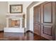 Elegant fireplace next to custom wood doors at 6322 E Turquoise Ave, Paradise Valley, AZ 85253