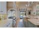 Bright kitchen with a center island, Wolf range, and double sink at 6322 E Turquoise Ave, Paradise Valley, AZ 85253