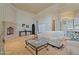 Open-concept living room with fireplace, tile floors and arch doorway at 6322 E Turquoise Ave, Paradise Valley, AZ 85253
