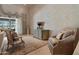 Elegant living room with ornate decor, fireplace and large windows at 6322 E Turquoise Ave, Paradise Valley, AZ 85253
