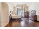Luxurious main bedroom featuring wood floors, custom drapery, and ample space at 6322 E Turquoise Ave, Paradise Valley, AZ 85253