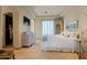 Spacious main bedroom with dresser and walk-in closet, providing ample storage and refined elegance at 6322 E Turquoise Ave, Paradise Valley, AZ 85253