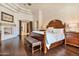 Spacious main bedroom with fireplace, wood floors, and designer details at 6322 E Turquoise Ave, Paradise Valley, AZ 85253