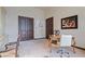 Well-appointed office space with elegant furnishings, dark wood doors, and a serene atmosphere for focused work at 6322 E Turquoise Ave, Paradise Valley, AZ 85253