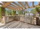 Well-equipped outdoor kitchen featuring stainless steel appliances, a built-in grill, and stone countertops at 6322 E Turquoise Ave, Paradise Valley, AZ 85253
