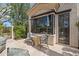 Charming outdoor patio with stone table and seating adjacent to the house, perfect for alfresco dining at 6322 E Turquoise Ave, Paradise Valley, AZ 85253