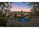 Stunning backyard pool and spa with lush landscaping, perfect for outdoor entertaining and relaxation at 6322 E Turquoise Ave, Paradise Valley, AZ 85253