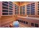 Warm sauna featuring wood paneling, seating, and ambient lighting at 6322 E Turquoise Ave, Paradise Valley, AZ 85253