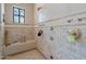 Luxurious walk-in shower with tiled walls and multiple showerheads at 6322 E Turquoise Ave, Paradise Valley, AZ 85253