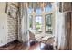 Charming sitting area with an abundance of natural light and custom drapery at 6322 E Turquoise Ave, Paradise Valley, AZ 85253