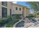 Charming stone water feature with stepping stones and lush greenery, adding tranquility to the landscape at 6322 E Turquoise Ave, Paradise Valley, AZ 85253