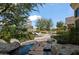 Beautiful stone water feature leading to outdoor seating, enhancing the serene ambiance of the property at 6322 E Turquoise Ave, Paradise Valley, AZ 85253