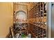 Spacious wine cellar with custom wood racking for ample bottle storage and a dedicated area for liquor display at 6322 E Turquoise Ave, Paradise Valley, AZ 85253
