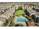 Aerial view showing community pool, green space, and homes at 2251 S Annie Ln, Gilbert, AZ 85295