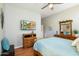 Serene bedroom with a wooden dresser and flat-screen TV at 2251 S Annie Ln, Gilbert, AZ 85295