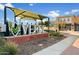 Verde community entrance sign with nearby shops at 2251 S Annie Ln, Gilbert, AZ 85295