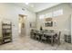 Bright dining room with farmhouse-style table and chairs at 2251 S Annie Ln, Gilbert, AZ 85295