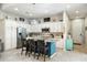 Open concept kitchen with island and white cabinets at 2251 S Annie Ln, Gilbert, AZ 85295